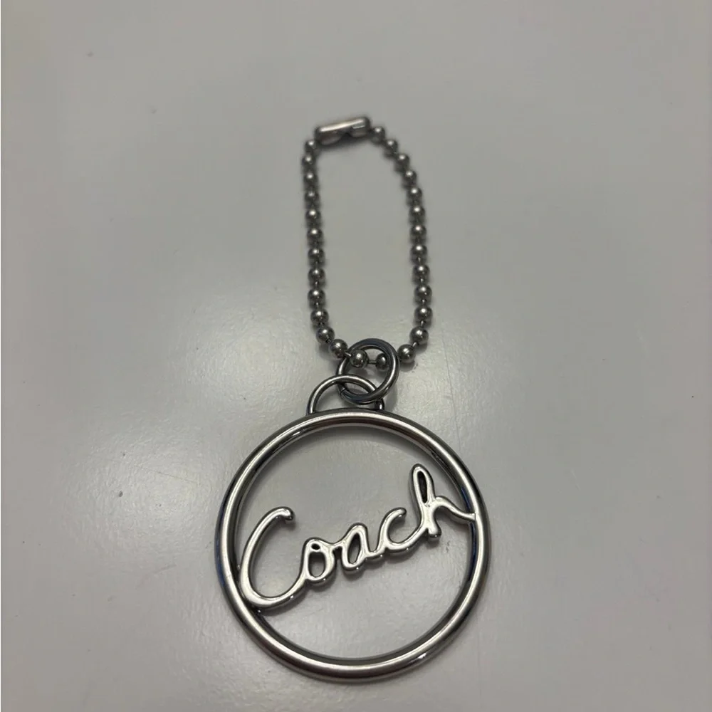 Coach round silver script spellout metal hang tag purse charm chain